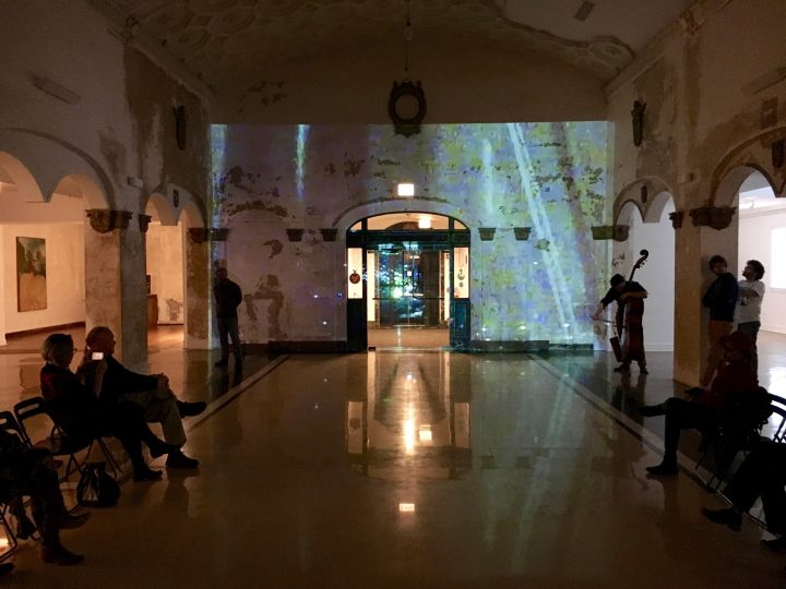 “The Sync; The Bridge #5”, May 5, 2016, with Hélary (flutes, effects, voice), Lonberg-Holm (cello, effects), Risser (piano), Sutton (bass), Gay (cornet/trumpet) & Ferrari (live video projection), performance, Stony Island Arts Bank, Chicago, Illinois USA. (image C. Maier)